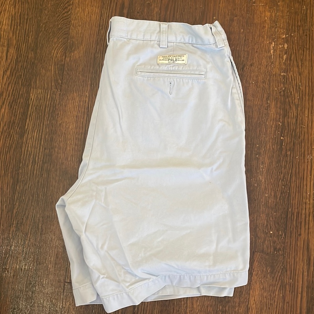 Size 36, pleated front men’s shorts in light blue. Polo by Ralph Lauren.
